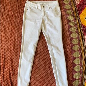 Super skinny mid rise white jeans